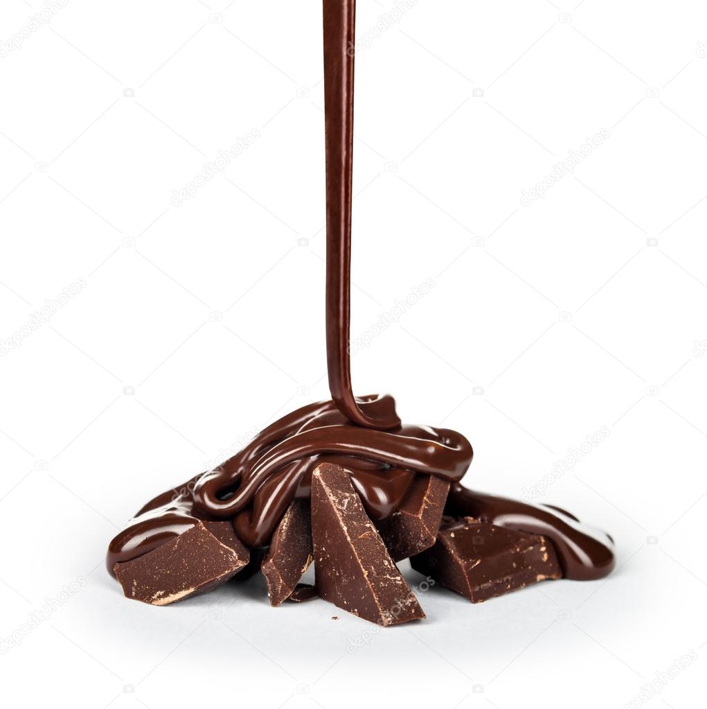 pouring chocolate into pieces isolated on white background