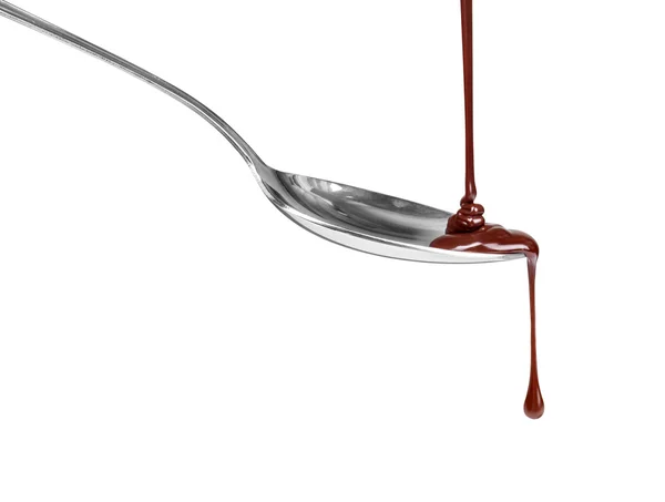 Chocolate dripping from a spoon, isolated on white background — Stock Photo, Image