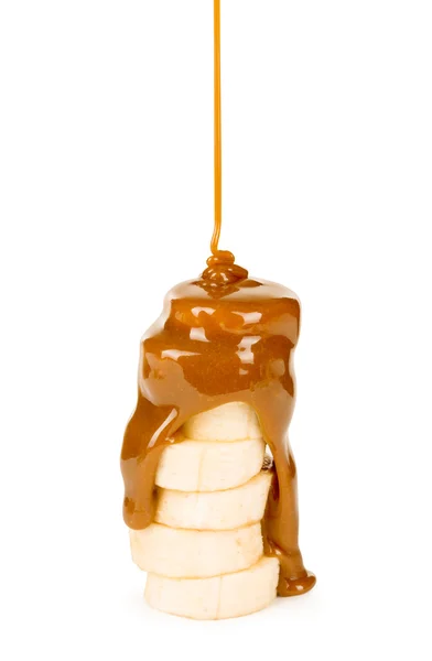 Caramelul este turnat pe o banană — Fotografie, imagine de stoc