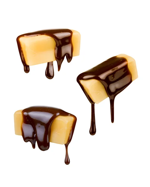 Milk candy in chocolate on a white background — Stock Photo, Image