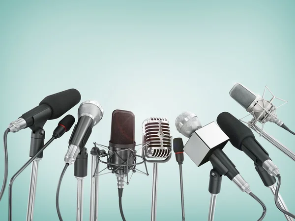 Various microphones aligned at press conference. — Stock Photo, Image