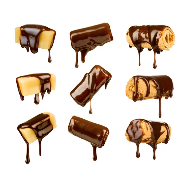 Collection of chocolates and cookies poured chocolate on a white — Stock Photo, Image