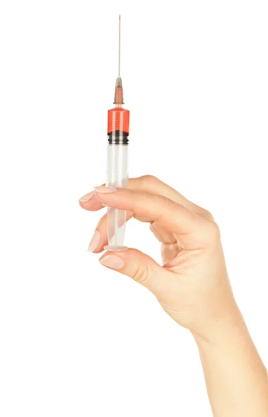 Spruta i kvinnans hand för att göra injektioner — Stockfoto