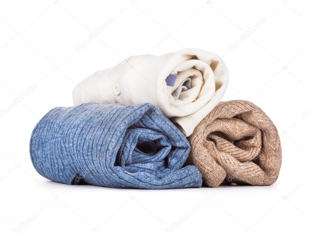 Three sweaters on a white background