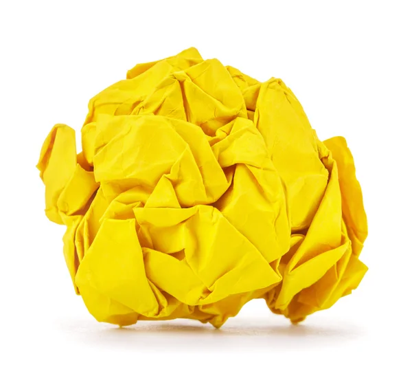 Rijke gele verfrommeld papier bal rolde op een witte achtergrond — Stockfoto