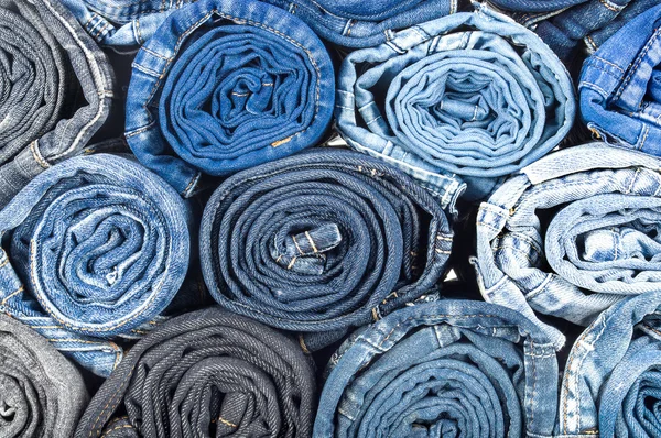 Background of twisted and colored jeans — Stock Photo, Image