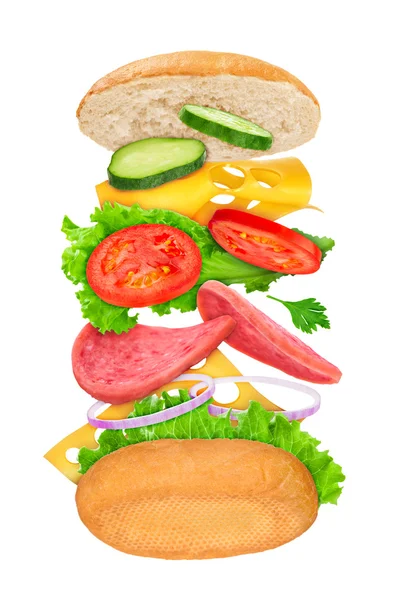 Πτώση σάντουιτς με συστατικά στον αέρα σε ένα λευκό φόντο — Φωτογραφία Αρχείου