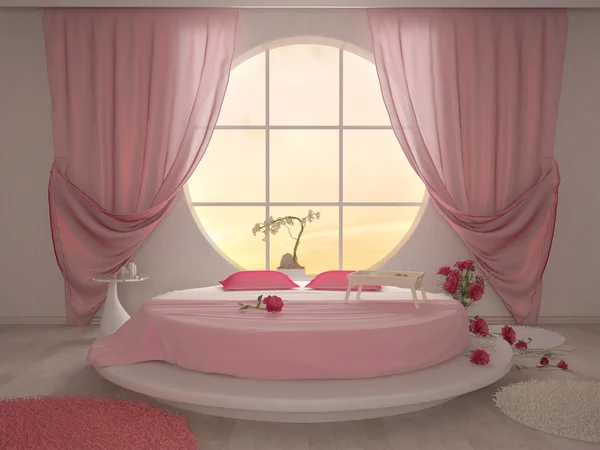 Dormitorio con una ventana circular y una cama redonda en rosa — Foto de Stock