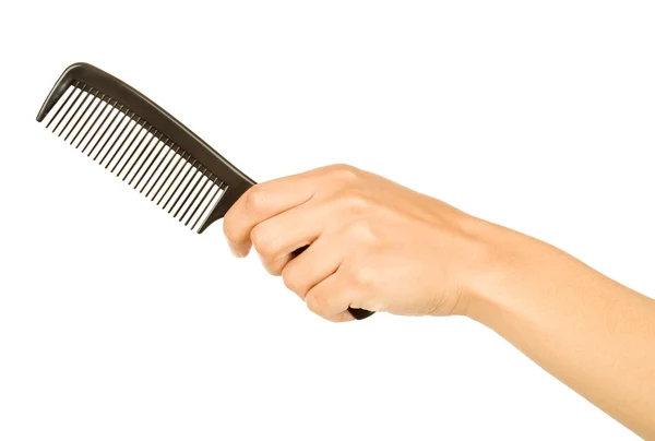 Spazzola per capelli nella mano isolata su bianco — Foto Stock