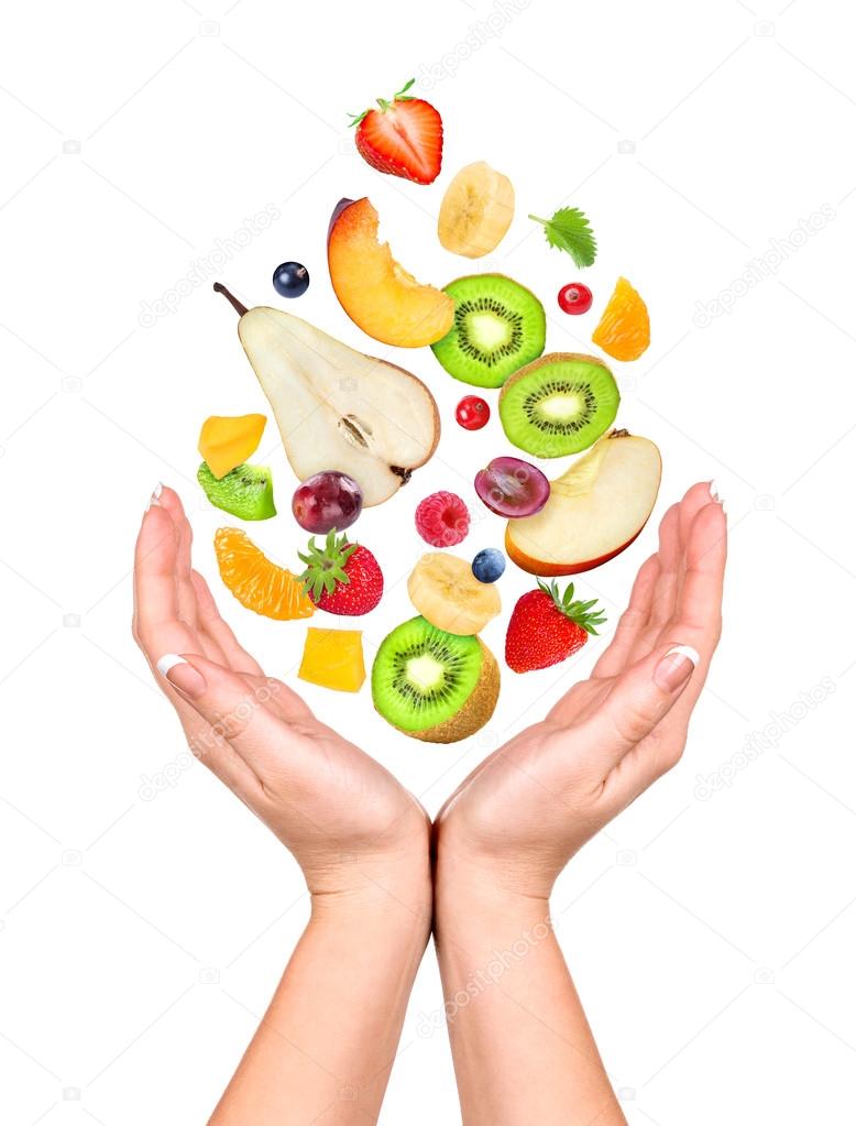 Concept: slim figure in your hands. Different fruits and berries