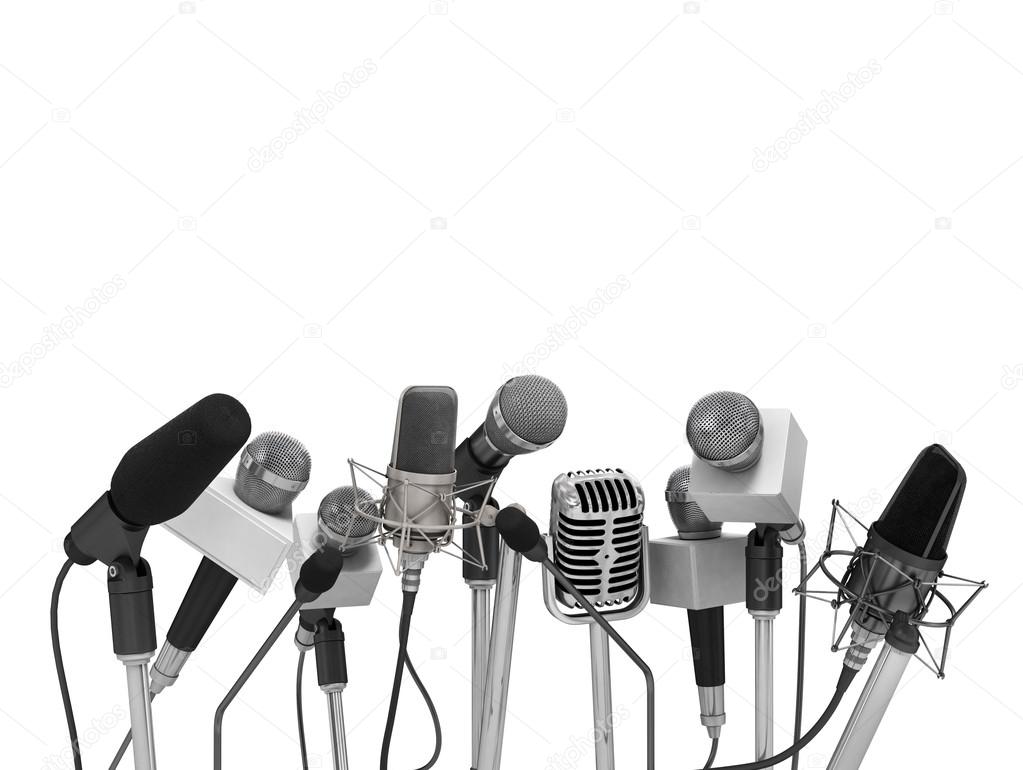 Press conference with standing microphones.