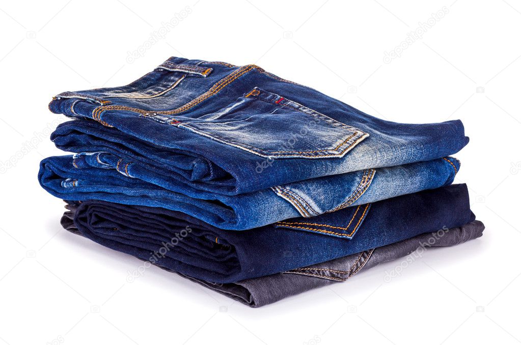 stack of blue jeans on a white background