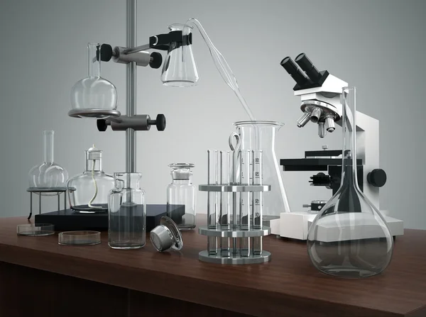 Δοκιμαστικοί σωλήνες με εργαστηριακό εξοπλισμό και μικροσκόπιο στο τραπέζι — Φωτογραφία Αρχείου