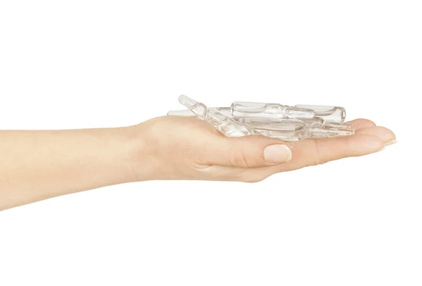 Medical ampoules in a hand on a white background — Stock Photo, Image