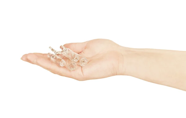 Medical ampoules in a hand on a white background — Stock Photo, Image