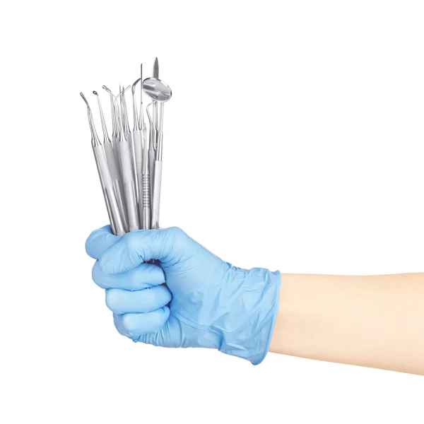 Ruce držící dentální nástroje — Stock fotografie