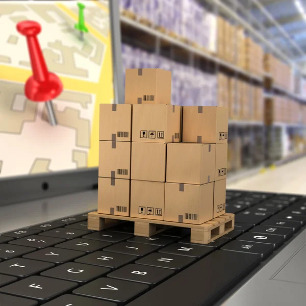 Shipping, delivery and logistics technology business industrial concept: macro view of heap of stacked corrugated cardboard package boxes on computer PC laptop notebook keyboard with selective focus — Stock Photo, Image