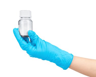 Mavi eldiven küçük şişe ilaç bir izole tutmak el