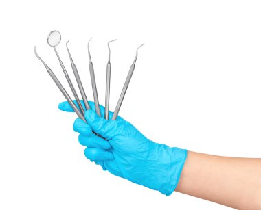 Mavi eldiven elinde bir çok diş aletleri bir Isola tutar.