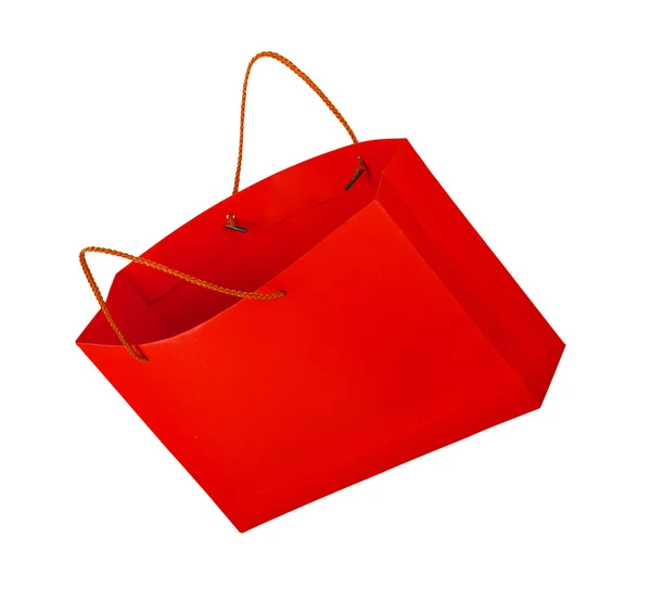 Rote Einkaufstasche in der Luft auf isoliertem weißem Hintergrund — Stockfoto
