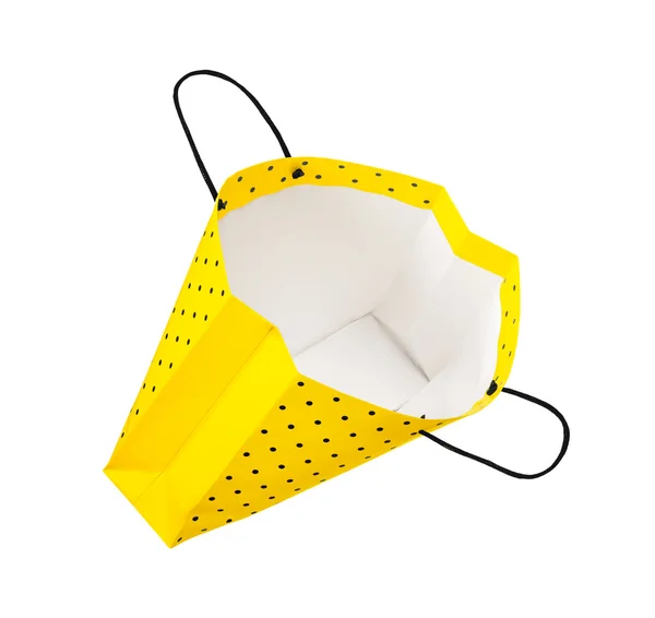 Hava izole bir beyaz zemin üzerine parlak sarı alışveriş çantası — Stok fotoğraf