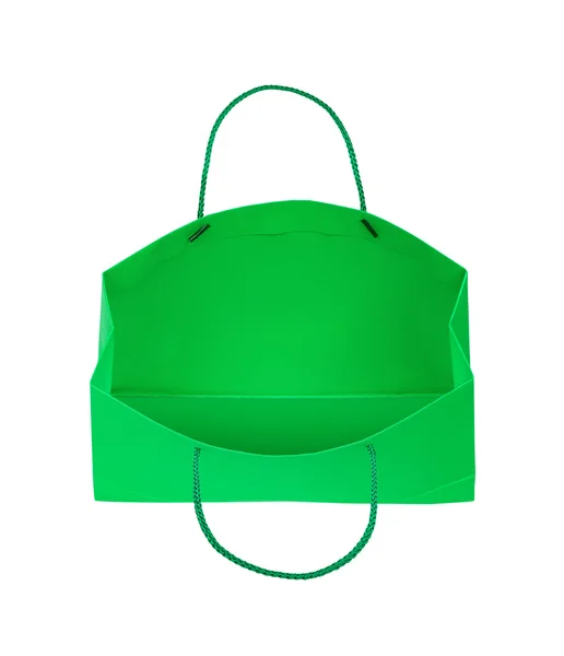 Groene geschenk tas valt door de lucht op een afgelegen witte backgr — Stockfoto