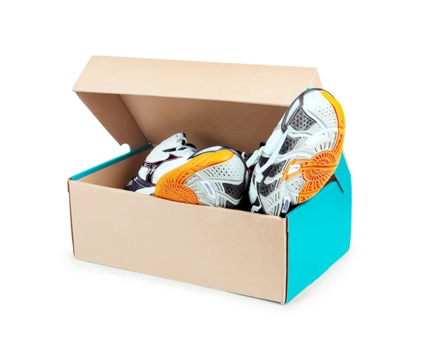 Pair of sneakers in shoe cardboard box isolated on white backgro — Stock Photo, Image