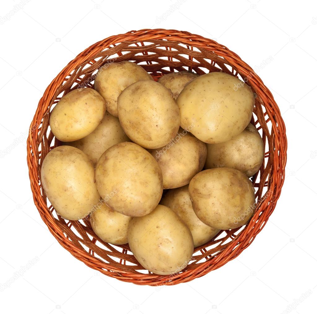 new potatoes in a basket on an isolated white background. view f