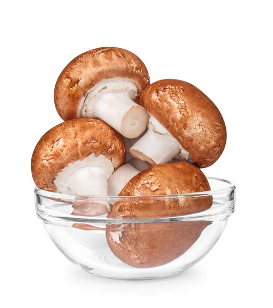 Brown mushrooms in a glass bowl isolated on white background — Stock Photo, Image
