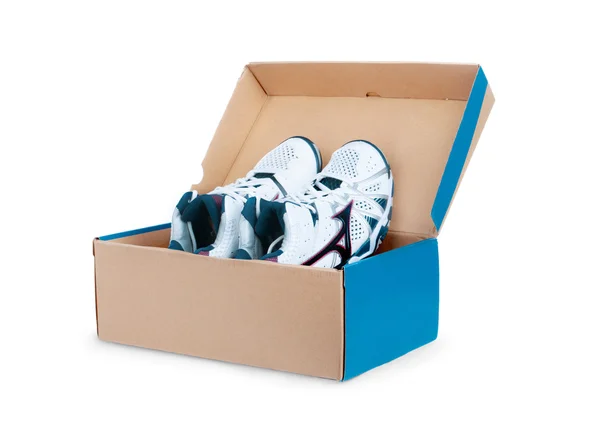 Pair of sneakers in shoe cardboard box isolated on white backgro — Stock Photo, Image