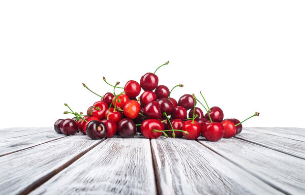 ripe cherries with reflection isolated white background