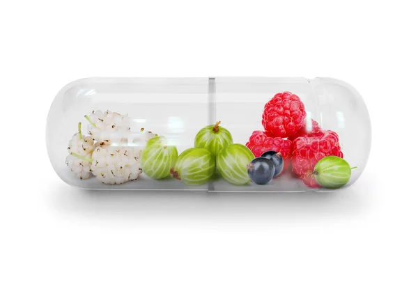 Medical capsule with berries isolated on white — Stock Photo, Image