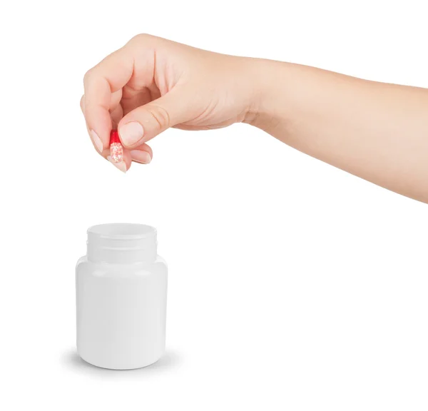 Hand holding a capsule or pill isolated on white — Stock Photo, Image
