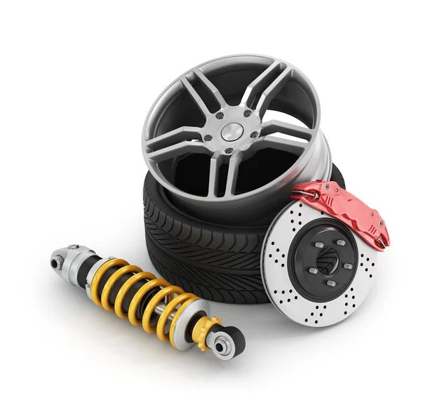 Frenos de coche con amortiguadores, neumáticos y llantas en el fondo blanco —  Fotos de Stock