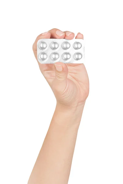 Woman holding pills. Isolated on a white background. — Stock Photo, Image