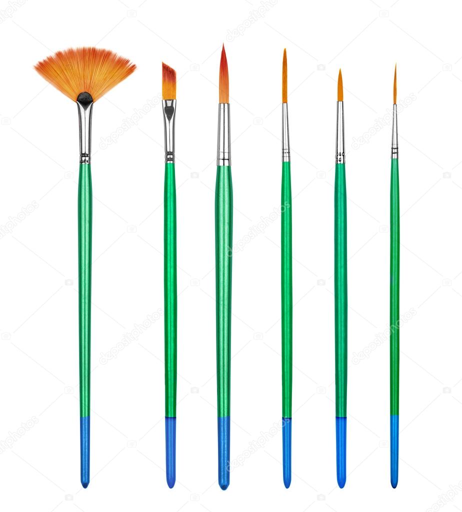 collection professional paint brushes on an isolated white backg