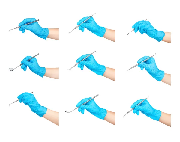 Coleta de instrumentos odontológicos nas mãos isoladas em branco — Fotografia de Stock