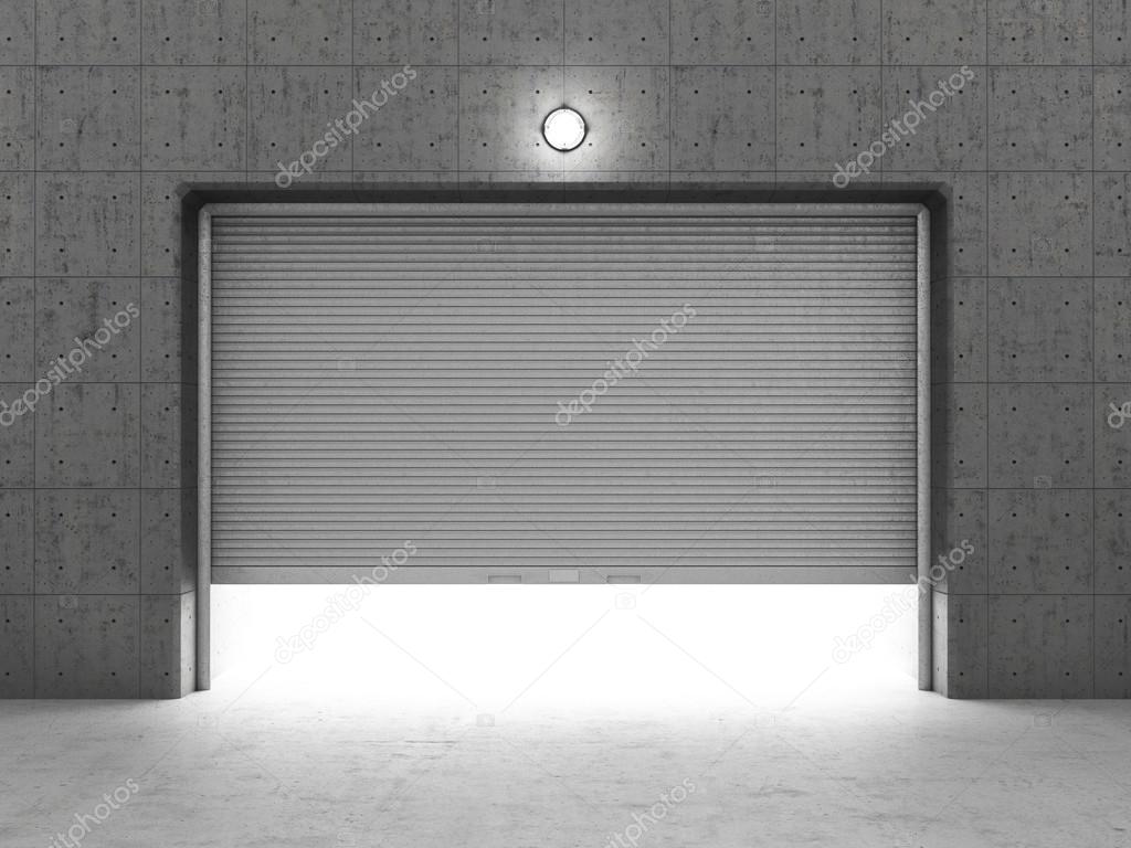 Garage building made of concrete with roller shutter doors.
