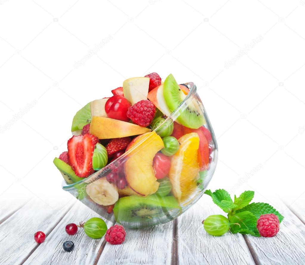 fruit salad in glass bowl white wooden table