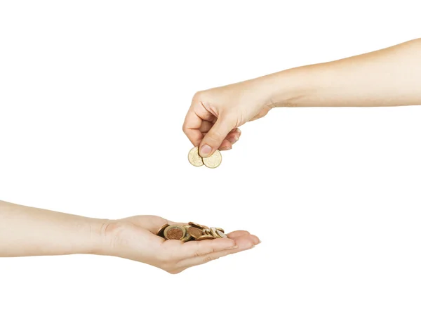 Kvinna att lägga mynt i en säkerhet kvinnlig hand — Stockfoto