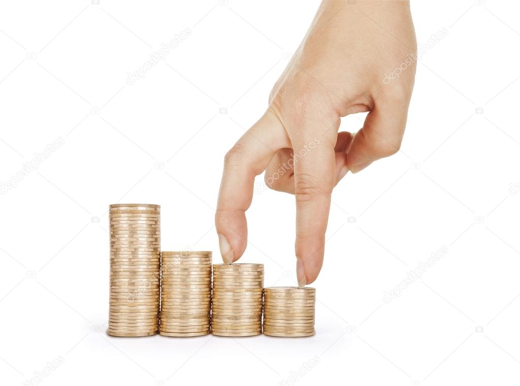 Economics growth concept - profit goes up. Hand and coins isolat