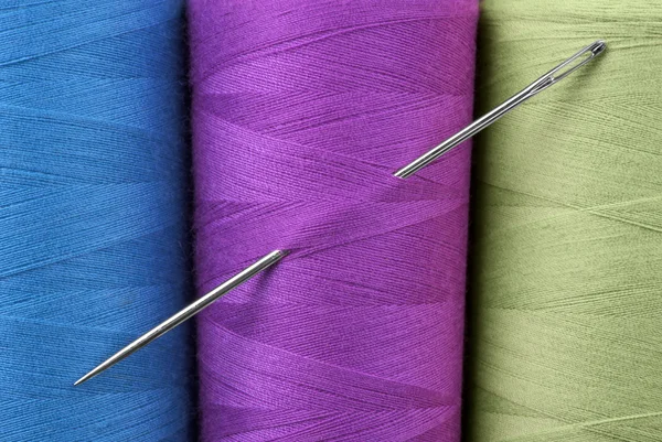 Colored thread and needle — Stock Photo, Image