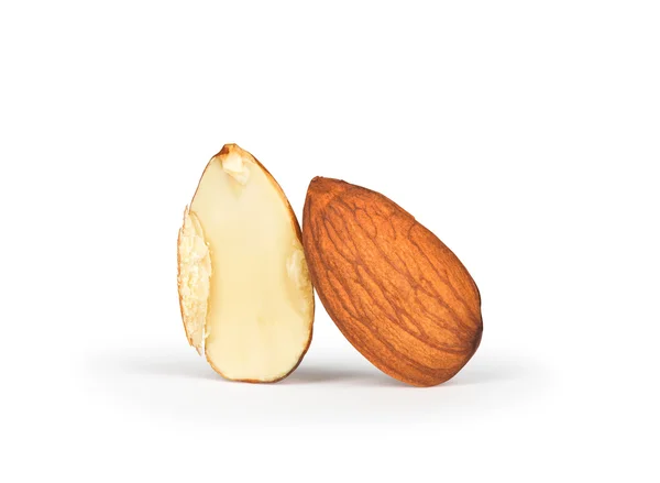 One full and half almonds isolated on white background — Stock Photo, Image