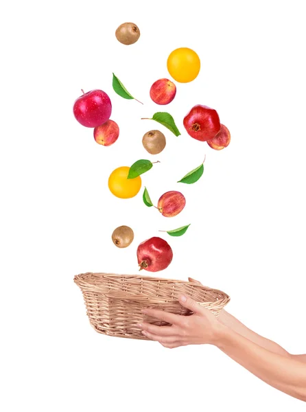 Fruit alling from basket isolated on a white — Stock Photo, Image