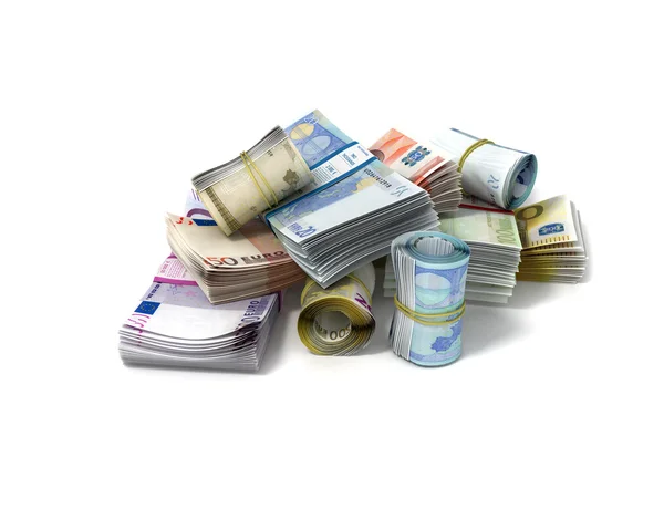 Rollen en stapels van euro-bankbiljetten — Stockfoto