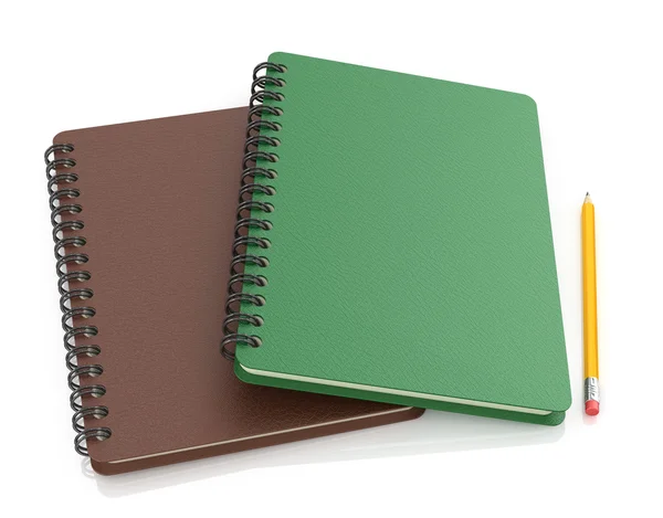 Bruine en groene laptop met potlood op witte achtergrond. — Stockfoto