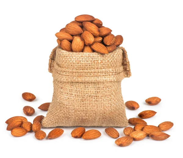 Almonds in burlap bag — Stock Photo, Image