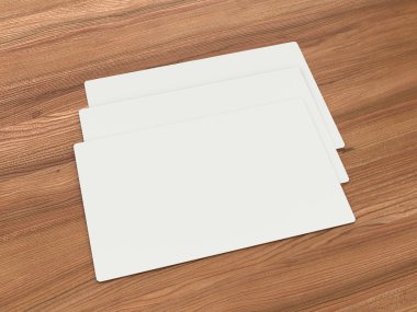 3 kartvizit bir ahşap kütük parçası üzerinde beyaz.