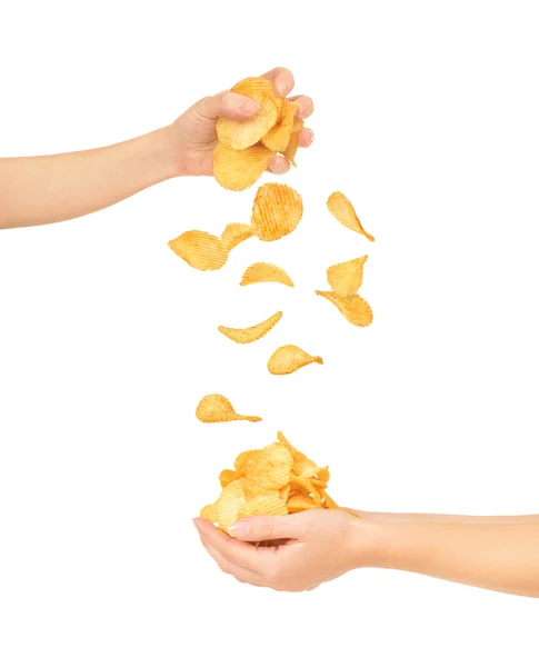 Female hands with chips isolated on white — Stock Photo, Image