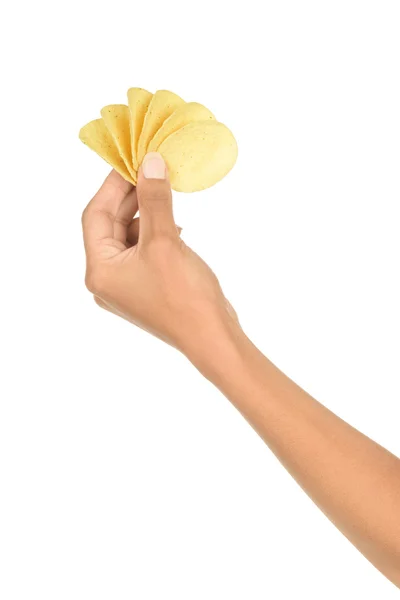 La mano sostiene papas fritas. Aislado sobre un fondo blanco . — Foto de Stock